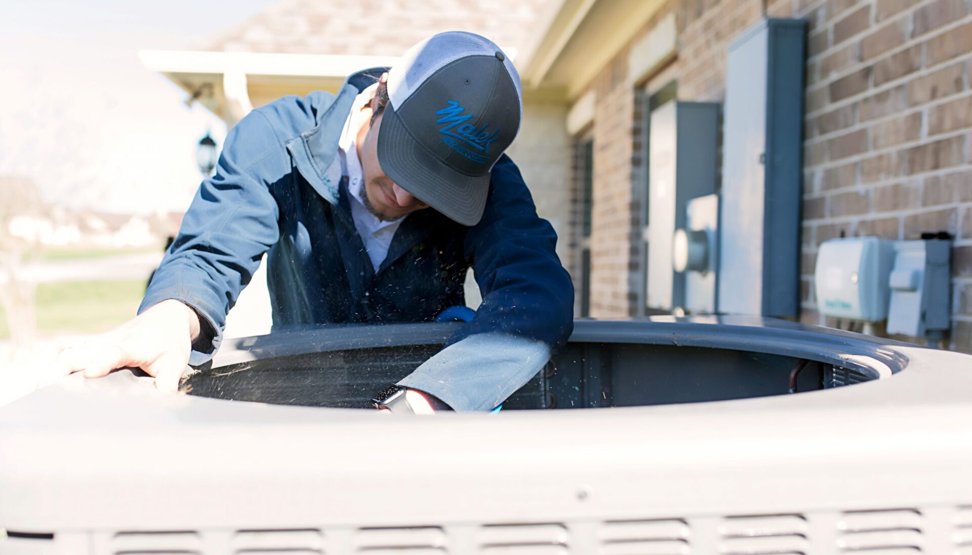 Technician fixes HVAC system.