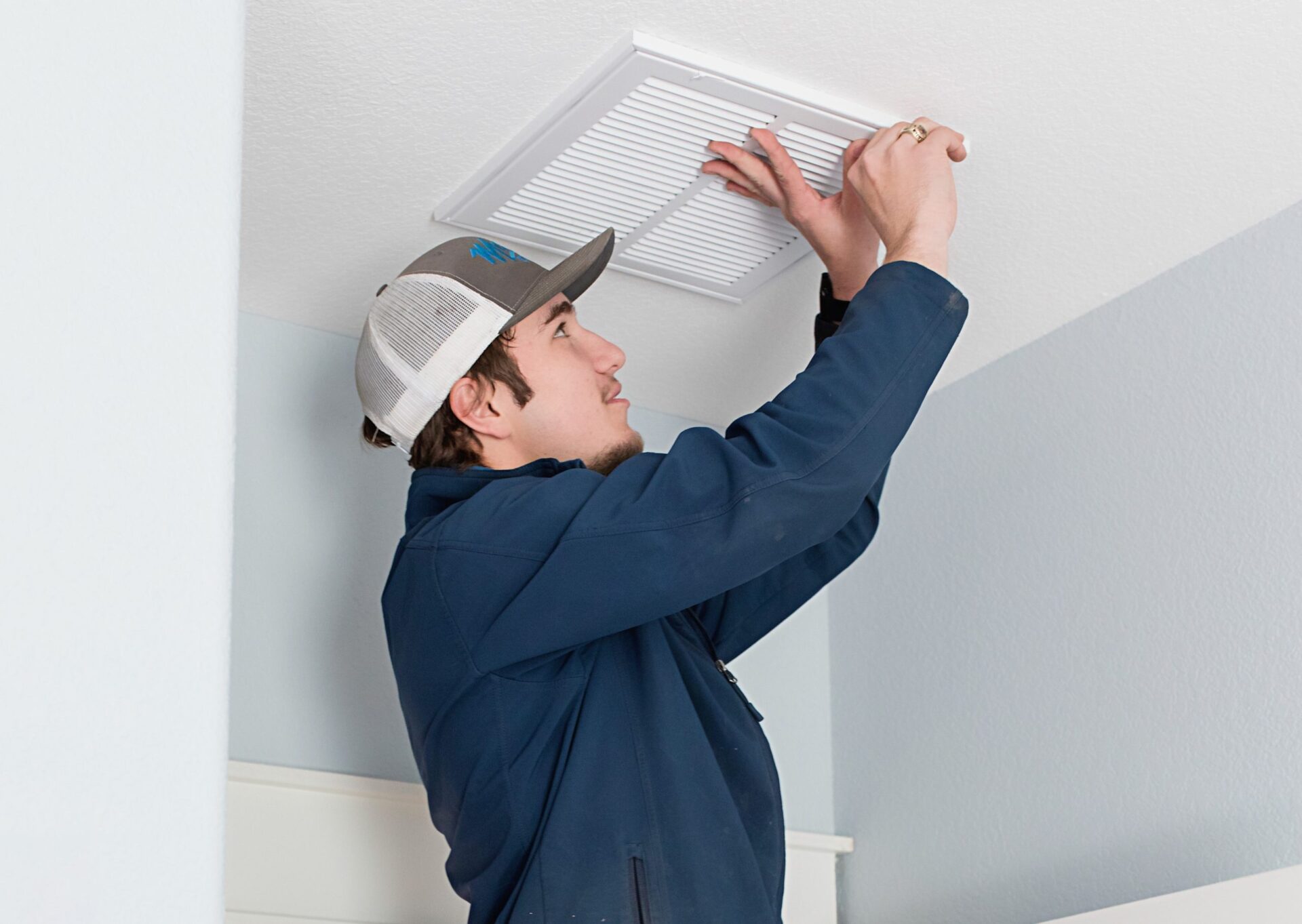 Malek Service technician checking air vent