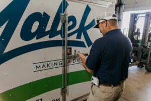 Photo of technician accessing trailer for a home service membership call