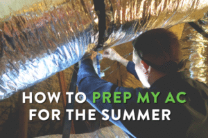 How to prep my ac for the summer title photo with technician looking at ductwork.