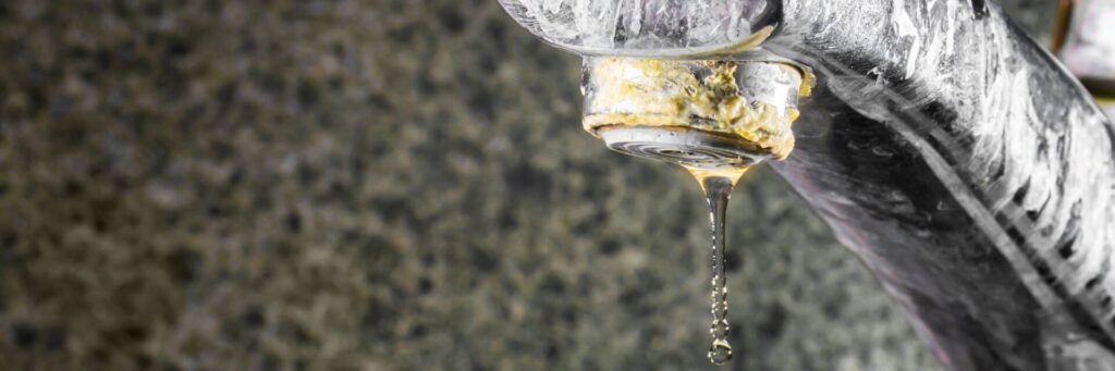 hard water limescale build up on a faucet