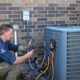 Technician performing an HVAC repair