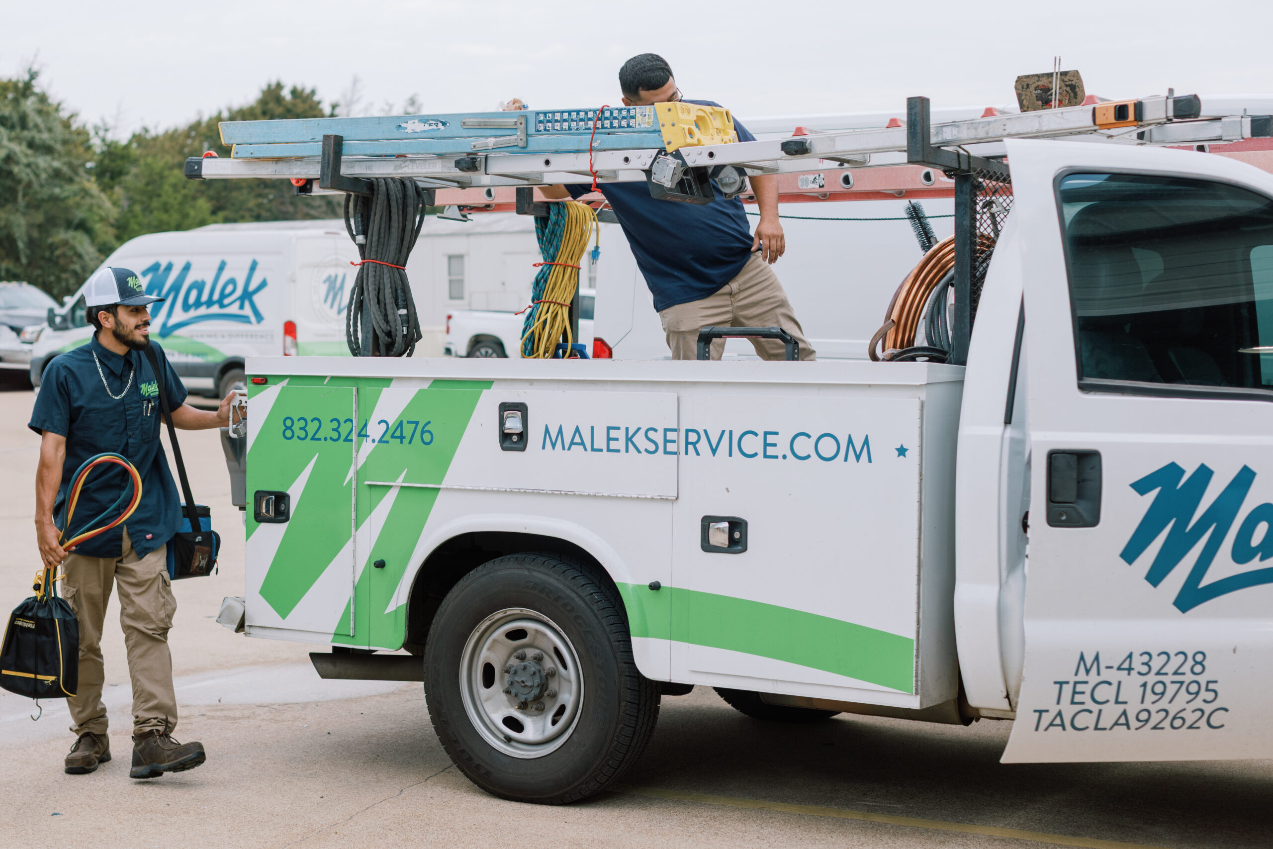 Malek Service Company technicians preparing for residential service