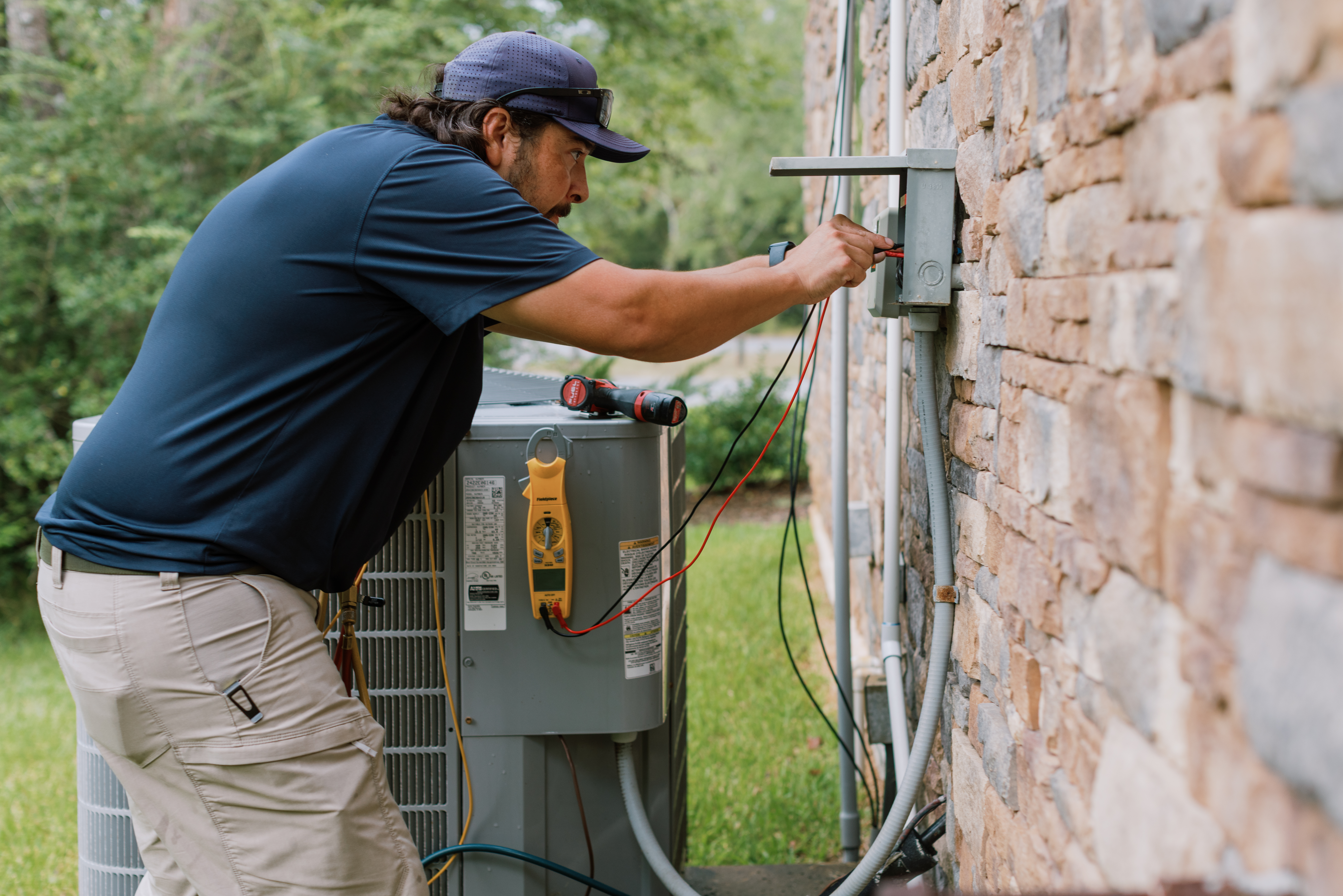 Malek HVAC professional responding to a residential air conditioning problem