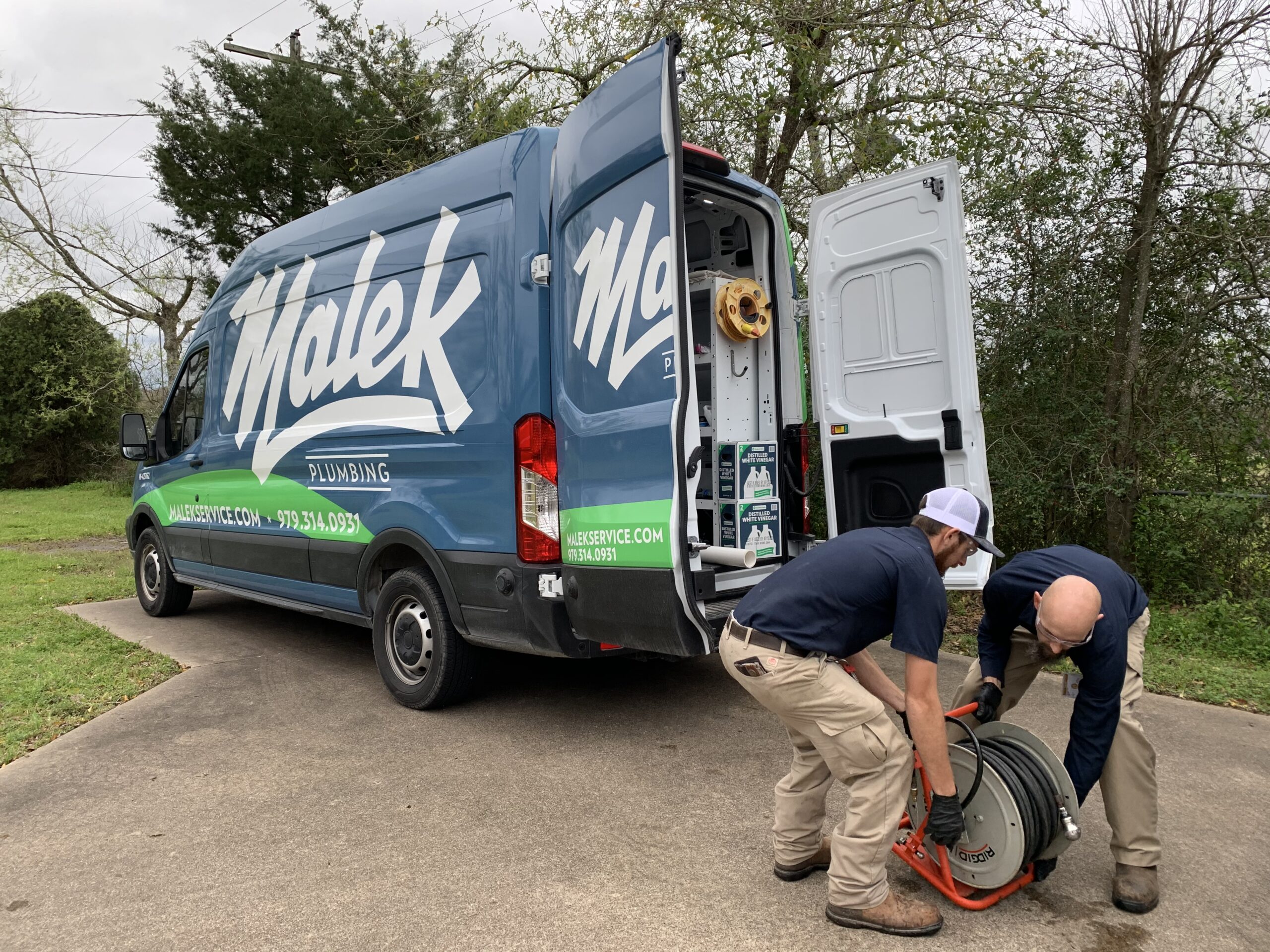 Malek plumber evaluating a residential tankless water heater system