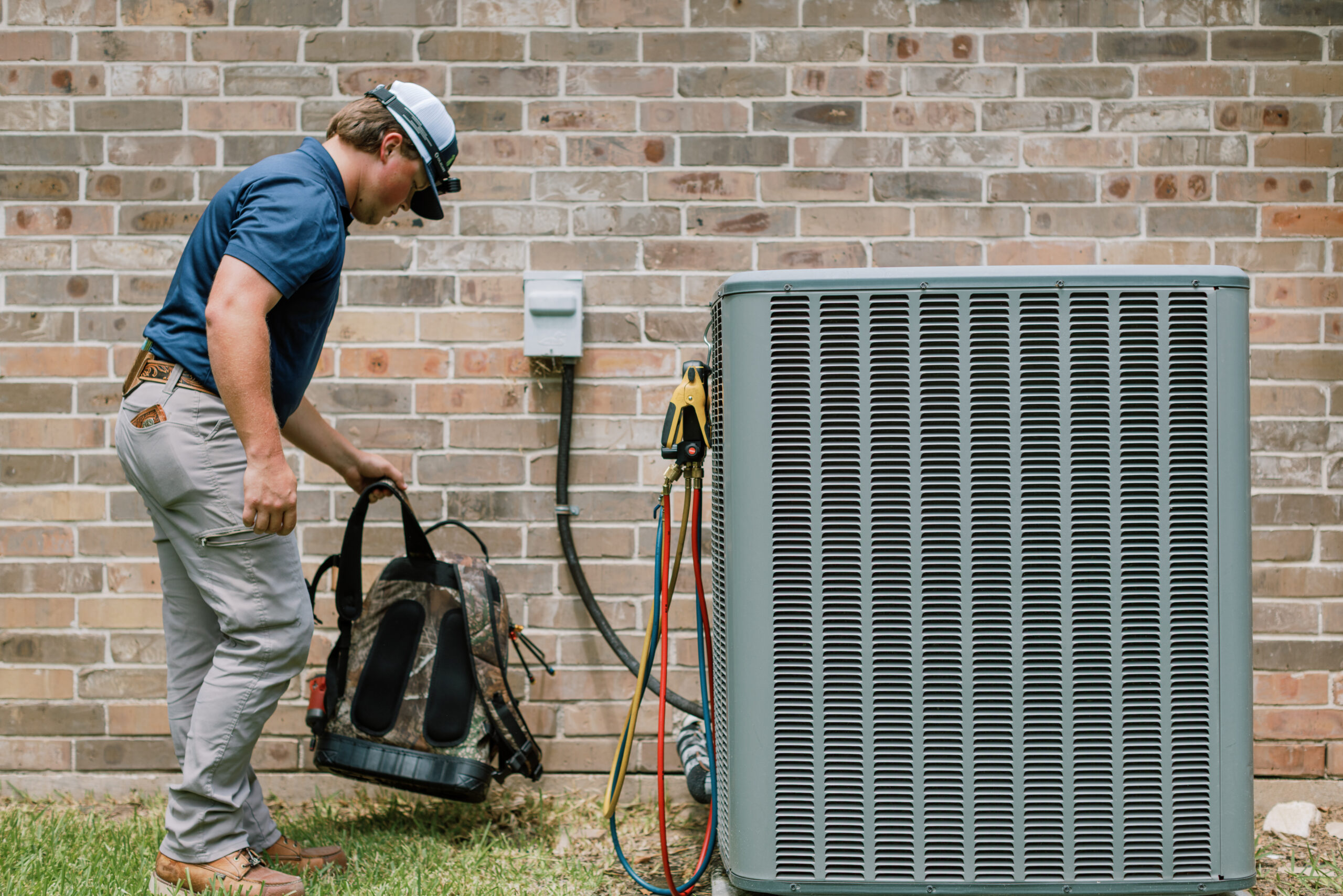 Malek HVAC technician explaining air conditioning service findings