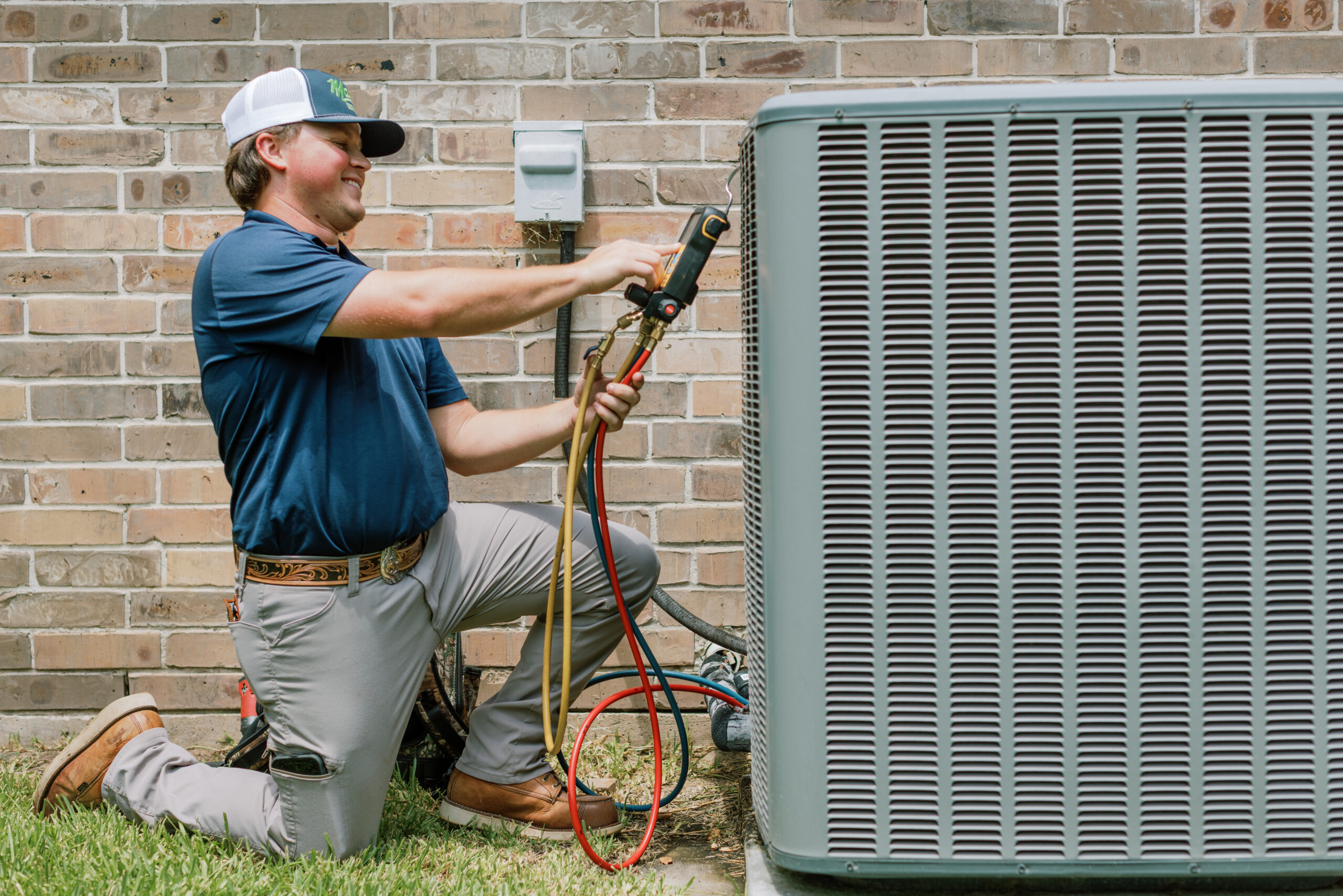 Malek HVAC professional performing residential air conditioning maintenance