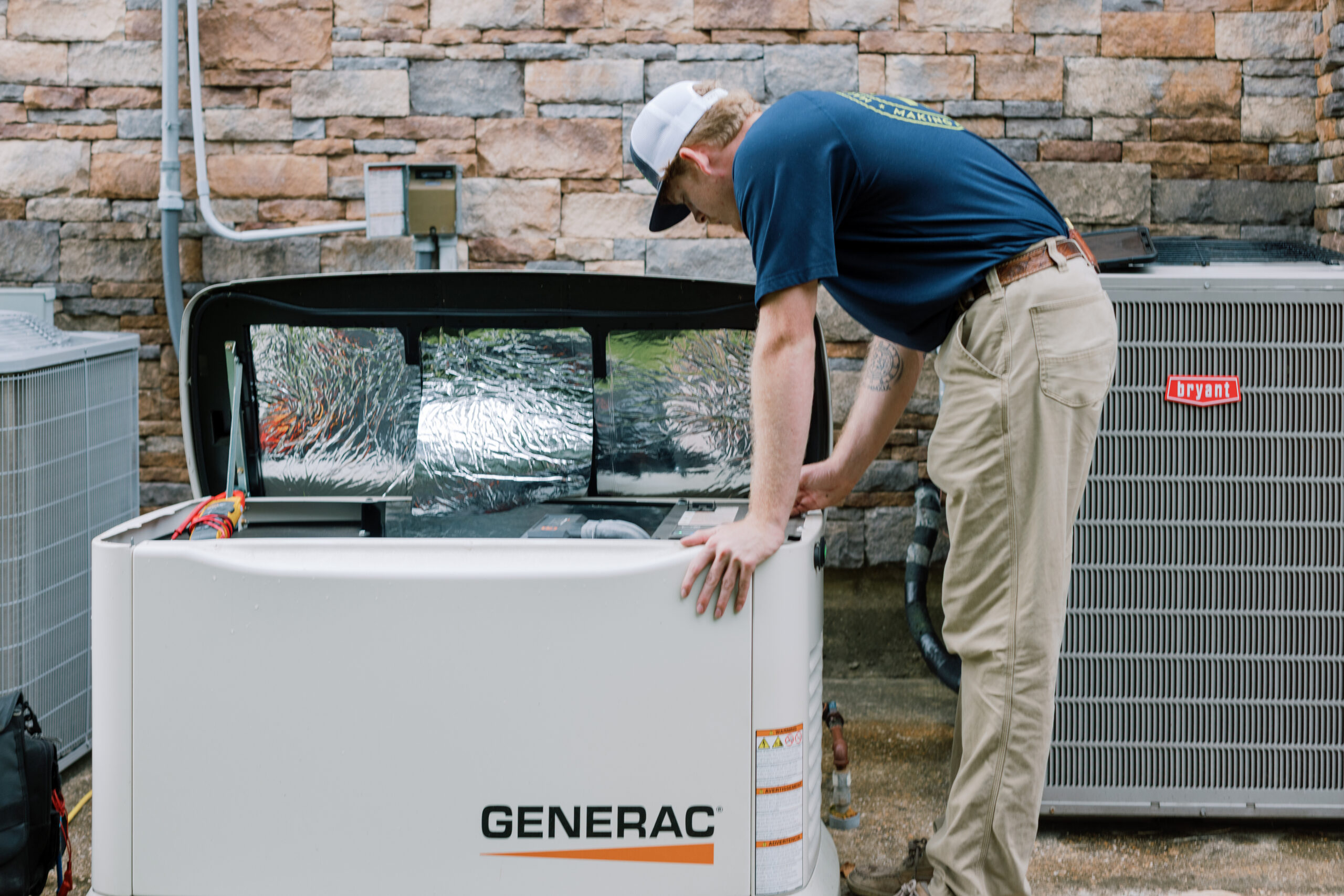 Malek technician working with whole-home generator equipment in Northwest Houston