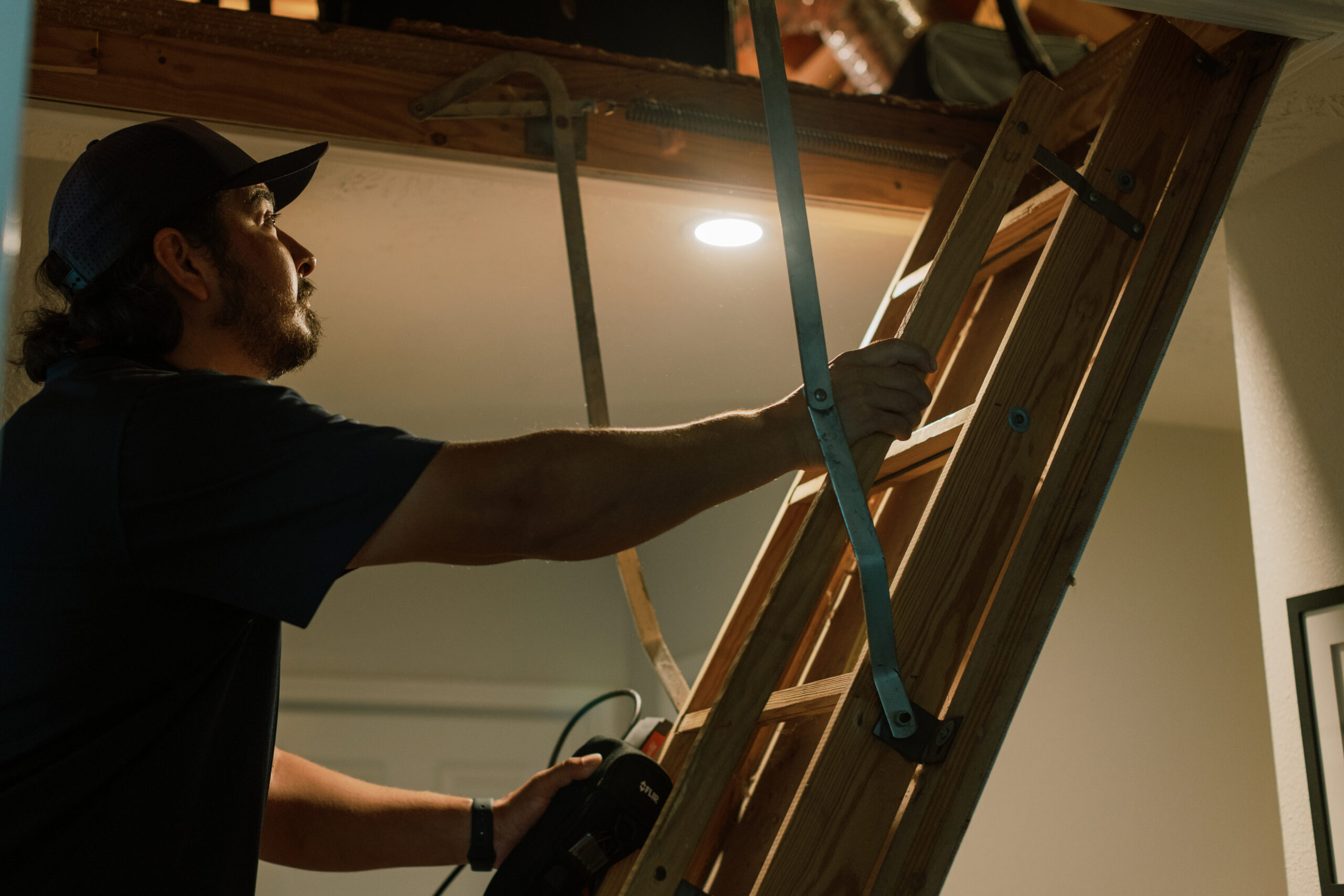 Malek HVAC technician evaluating residential heating equipment