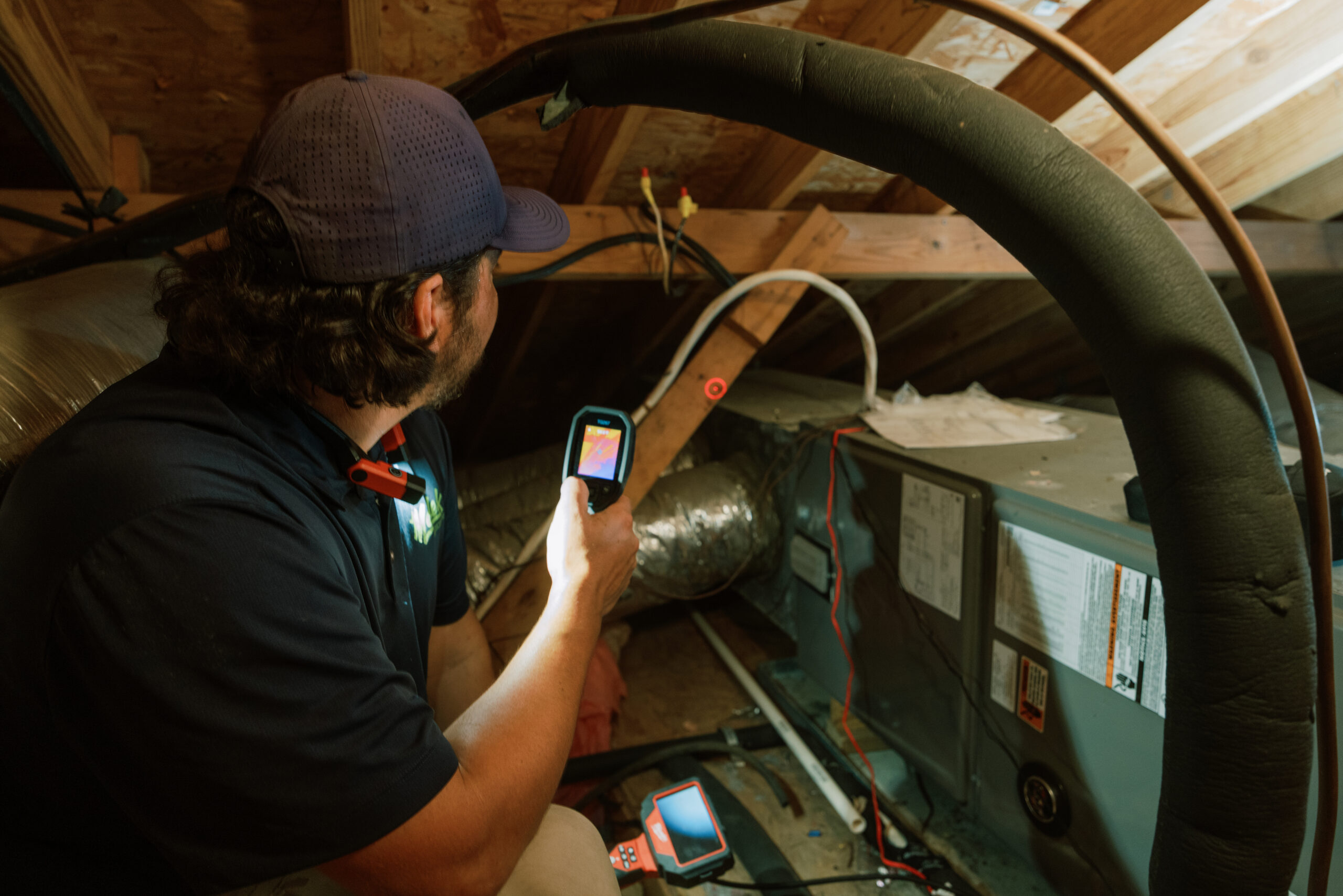 Malek HVAC professional servicing residential heating equipment