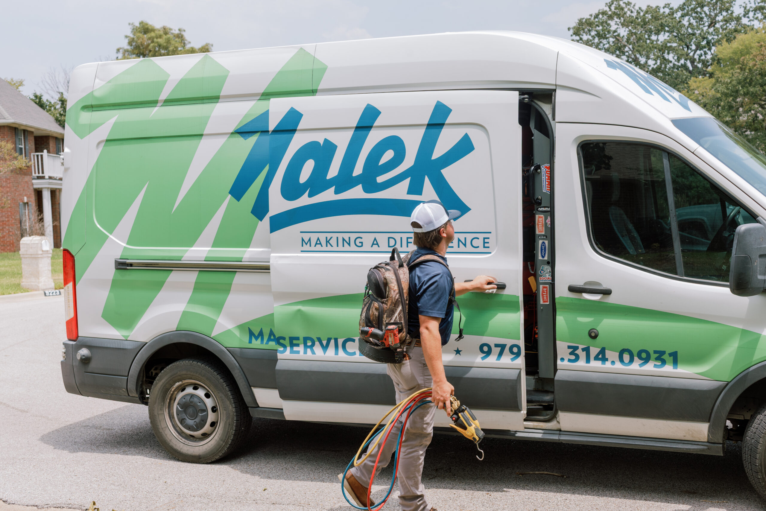 Malek service professional helping a Central Texas homeowner