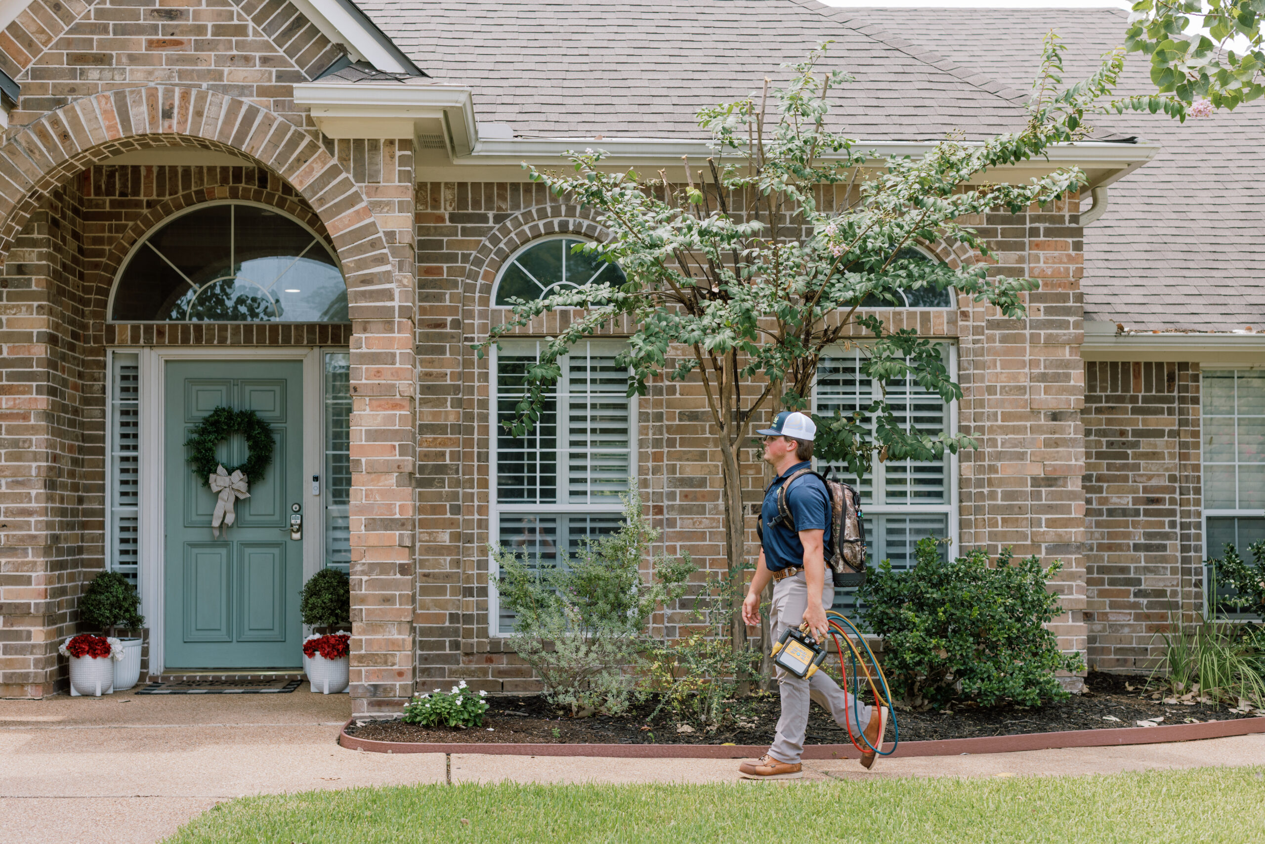 Malek service professional helping a homeowner