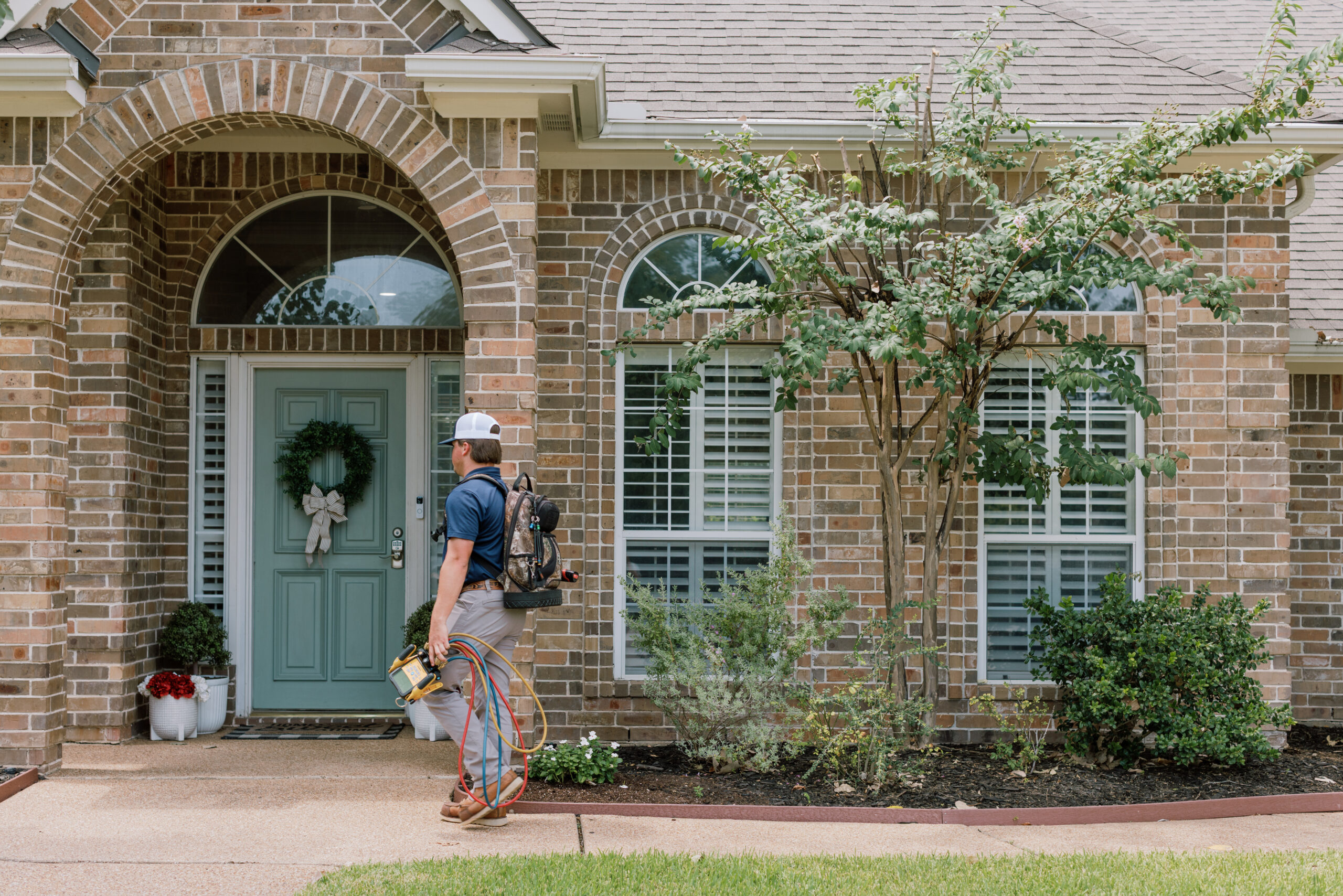Malek service professional helping a Central Texas homeowner