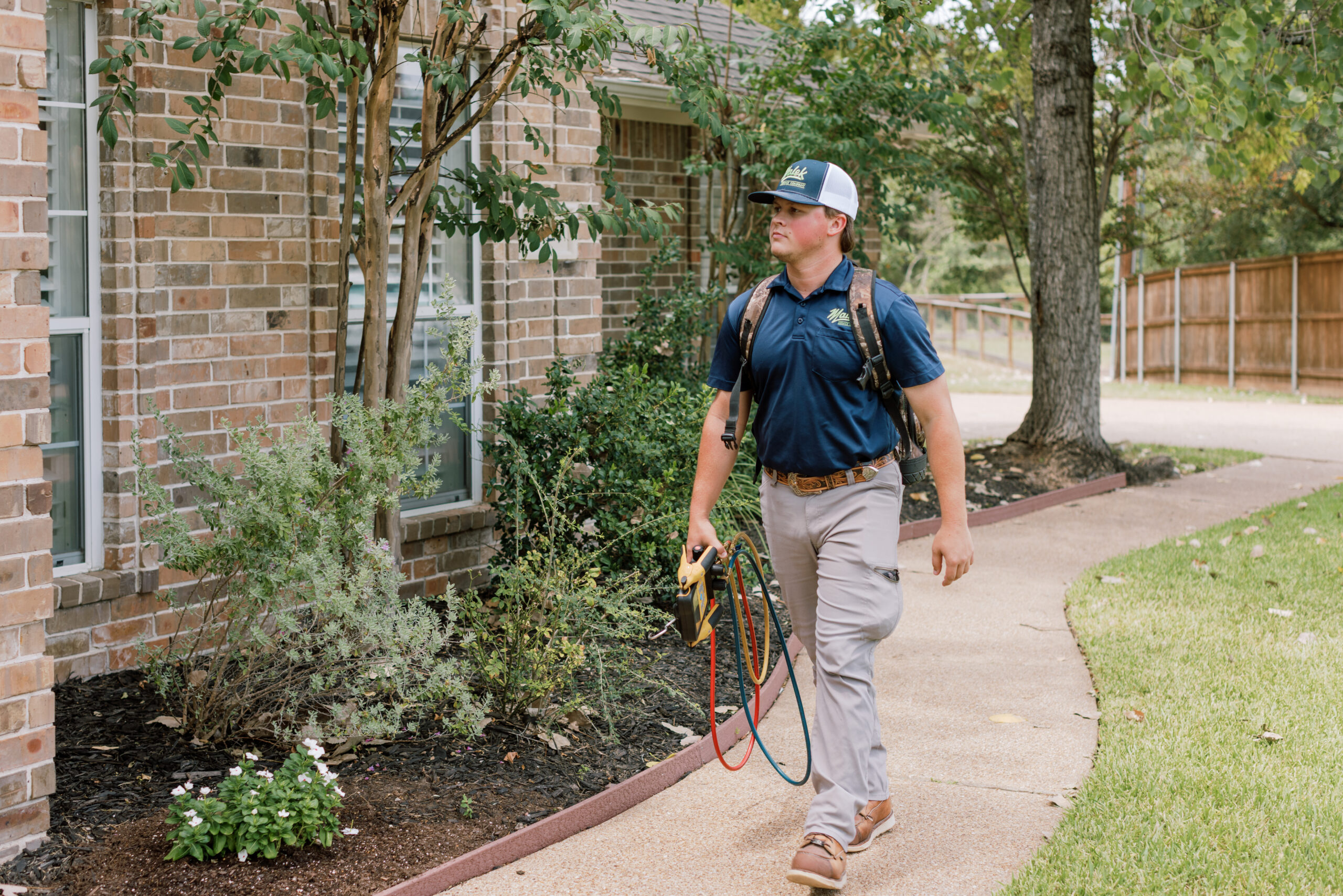 Malek service professional helping a Central Texas homeowner