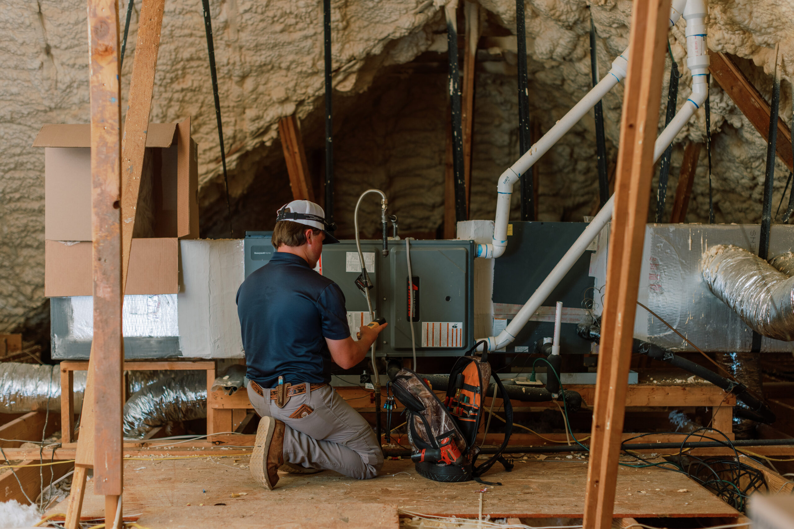 Malek HVAC professional evaluating a residential ductwork system
