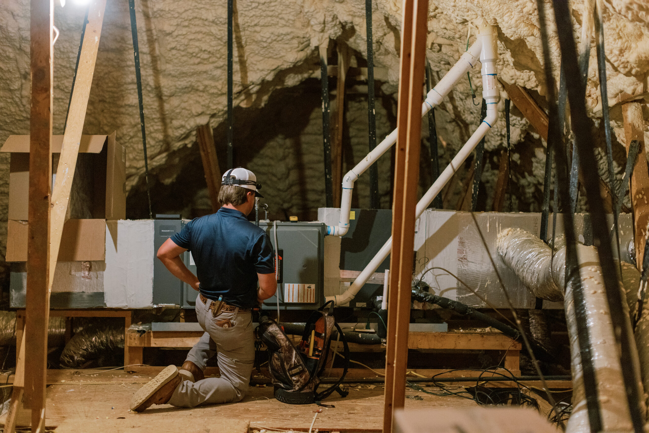 Malek HVAC technician servicing residential heating equipment