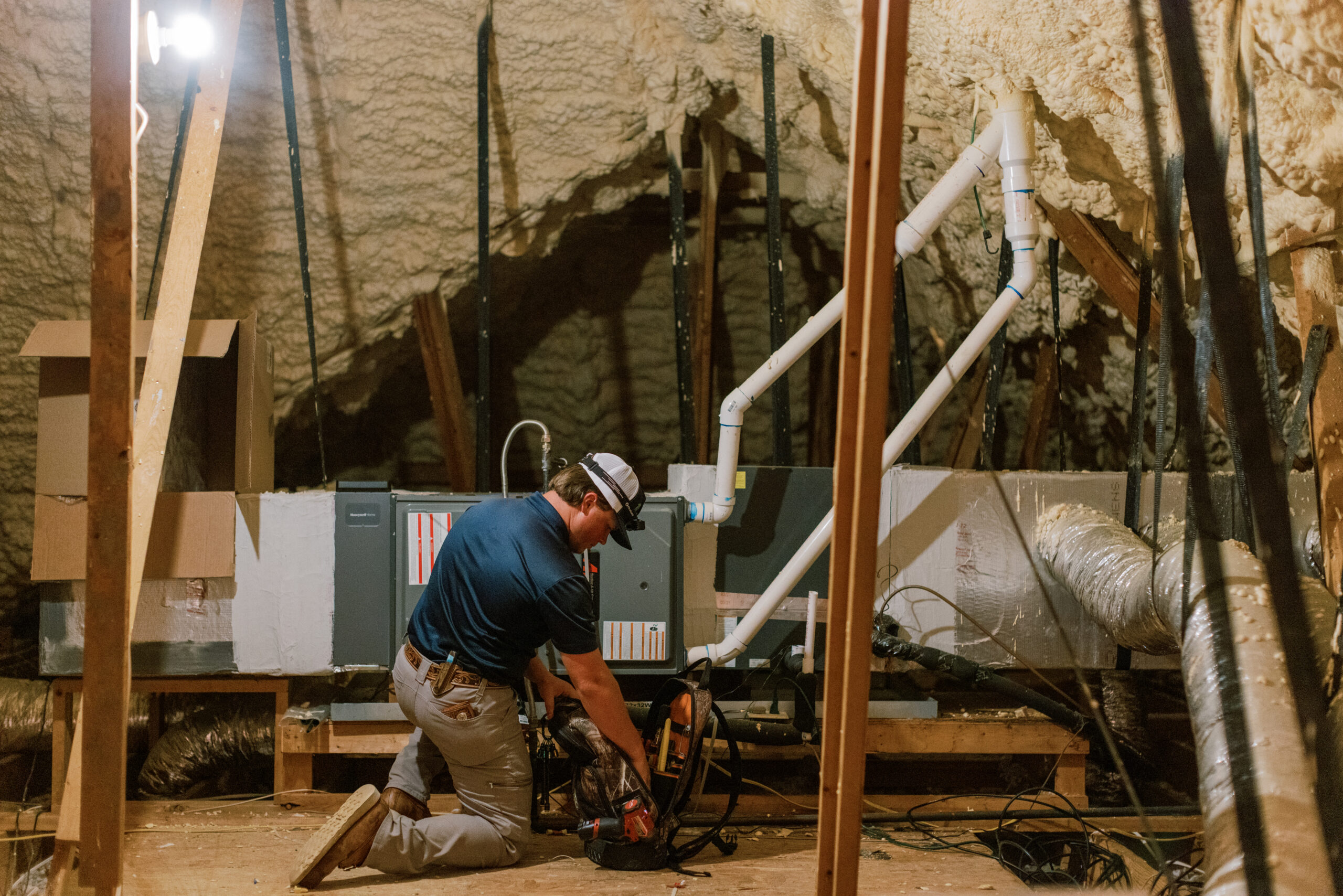 Malek HVAC technician performing residential furnace maintenance