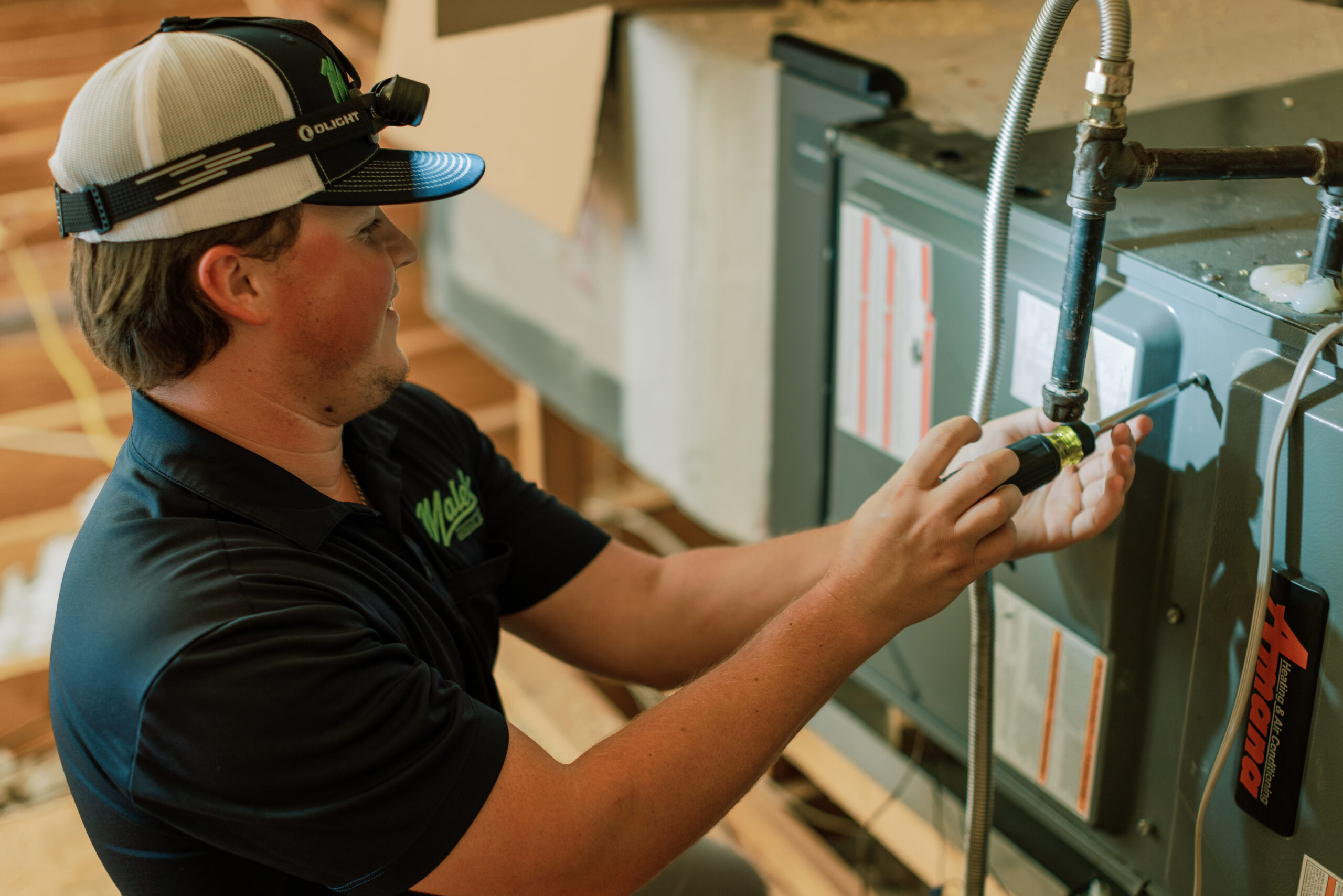 Malek HVAC technician evaluating residential heating equipment