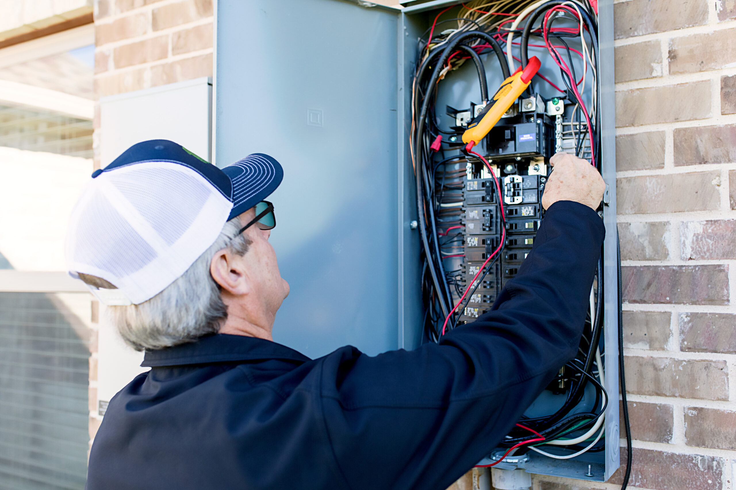 Malek electrician evaluating a residential electrical panel